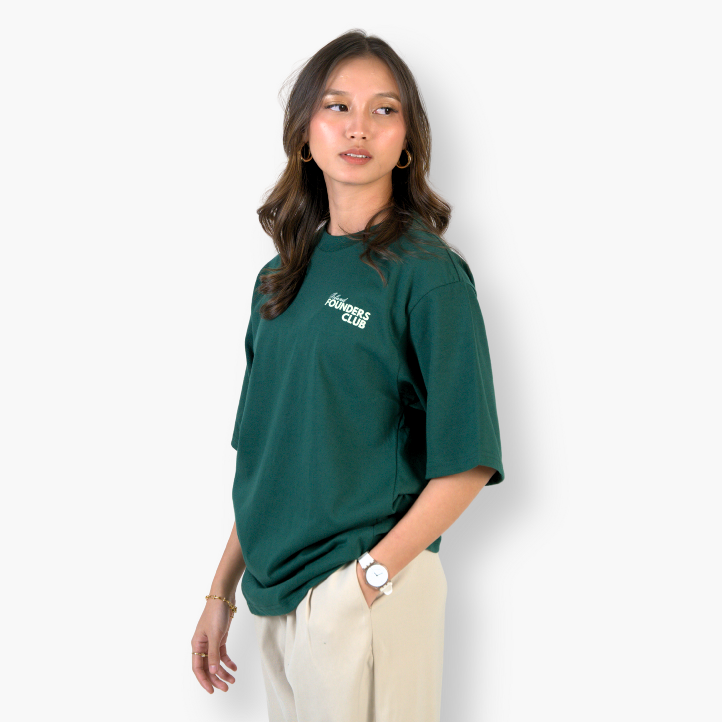 Woman wearing a green Isang Isla t-shirt clothing with text on a white background